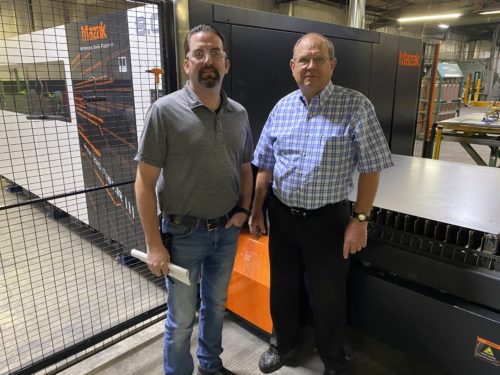 Owner & General Manager in front of Mazak Laser